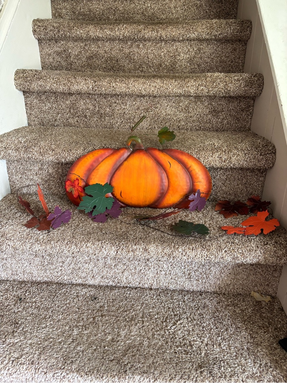 Metal pumpkin and garland